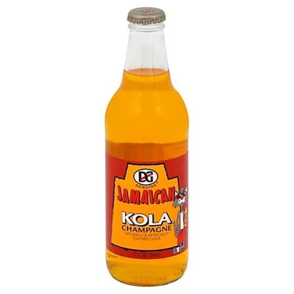 A bottle of DG Genuine Jamaican Kola Champagne soda with a red and yellow label.